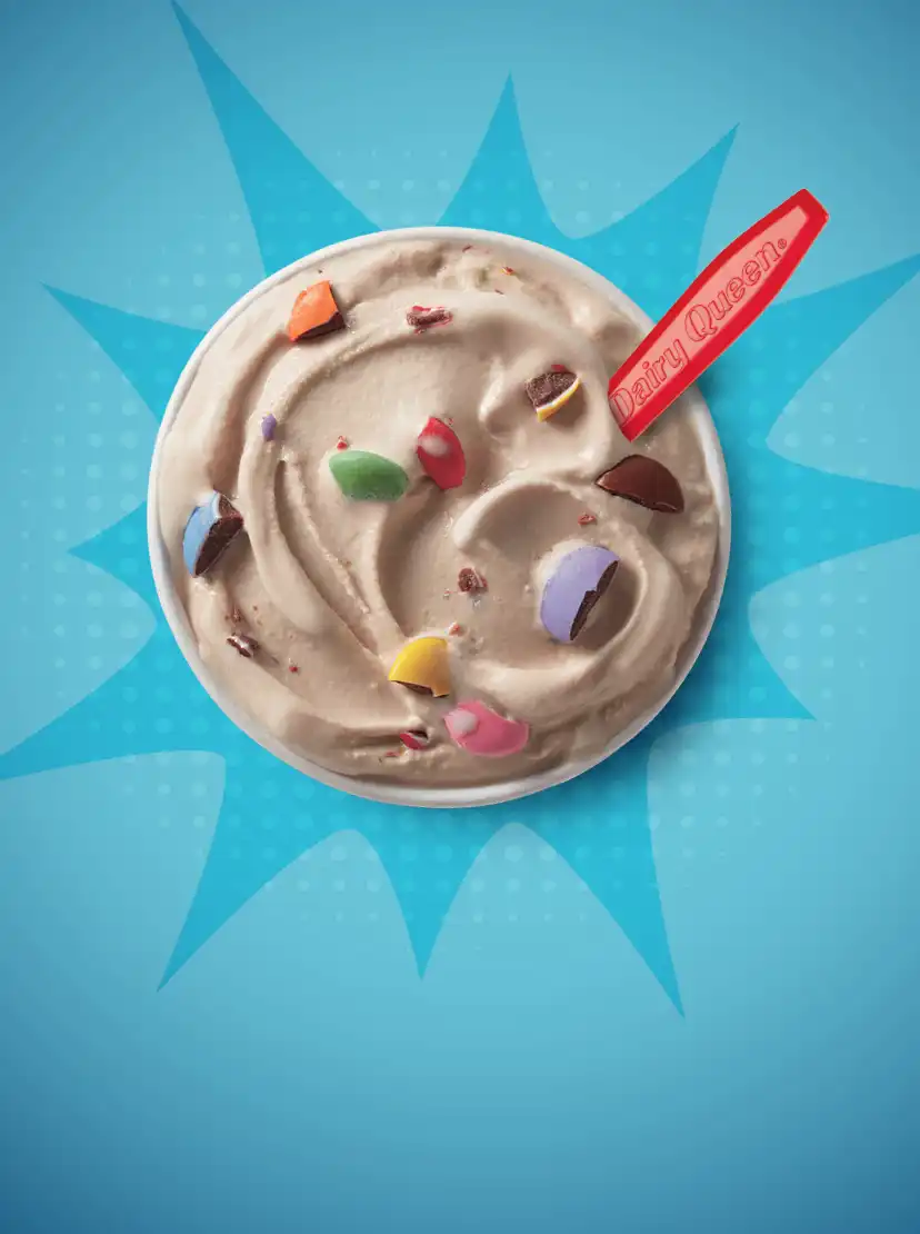 Overhead image of smarties blizzard and DQ red spoon